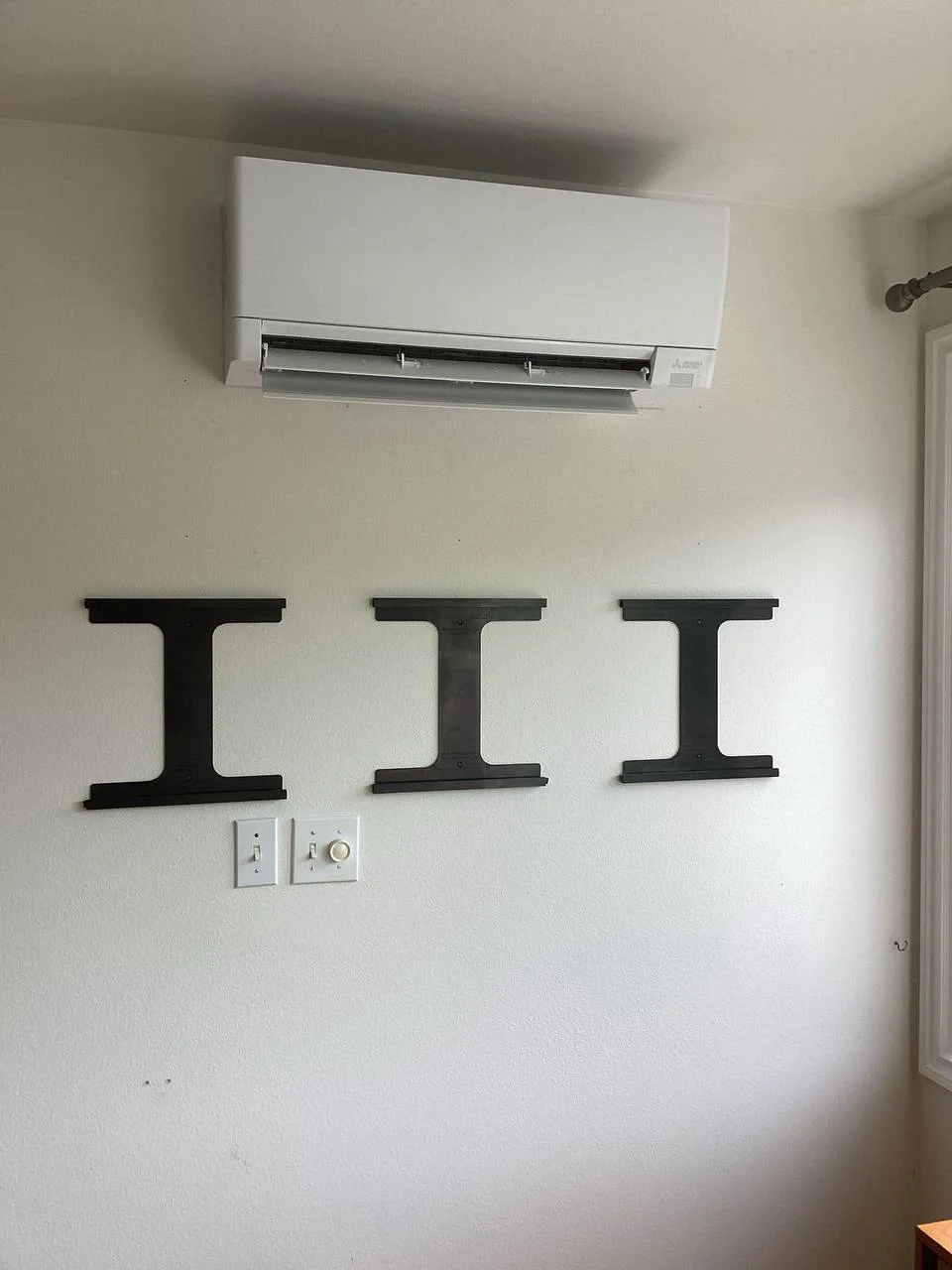 Modern wall-mounted air conditioner indoor unit delivering Mini Split Services Greater Puget Sound.