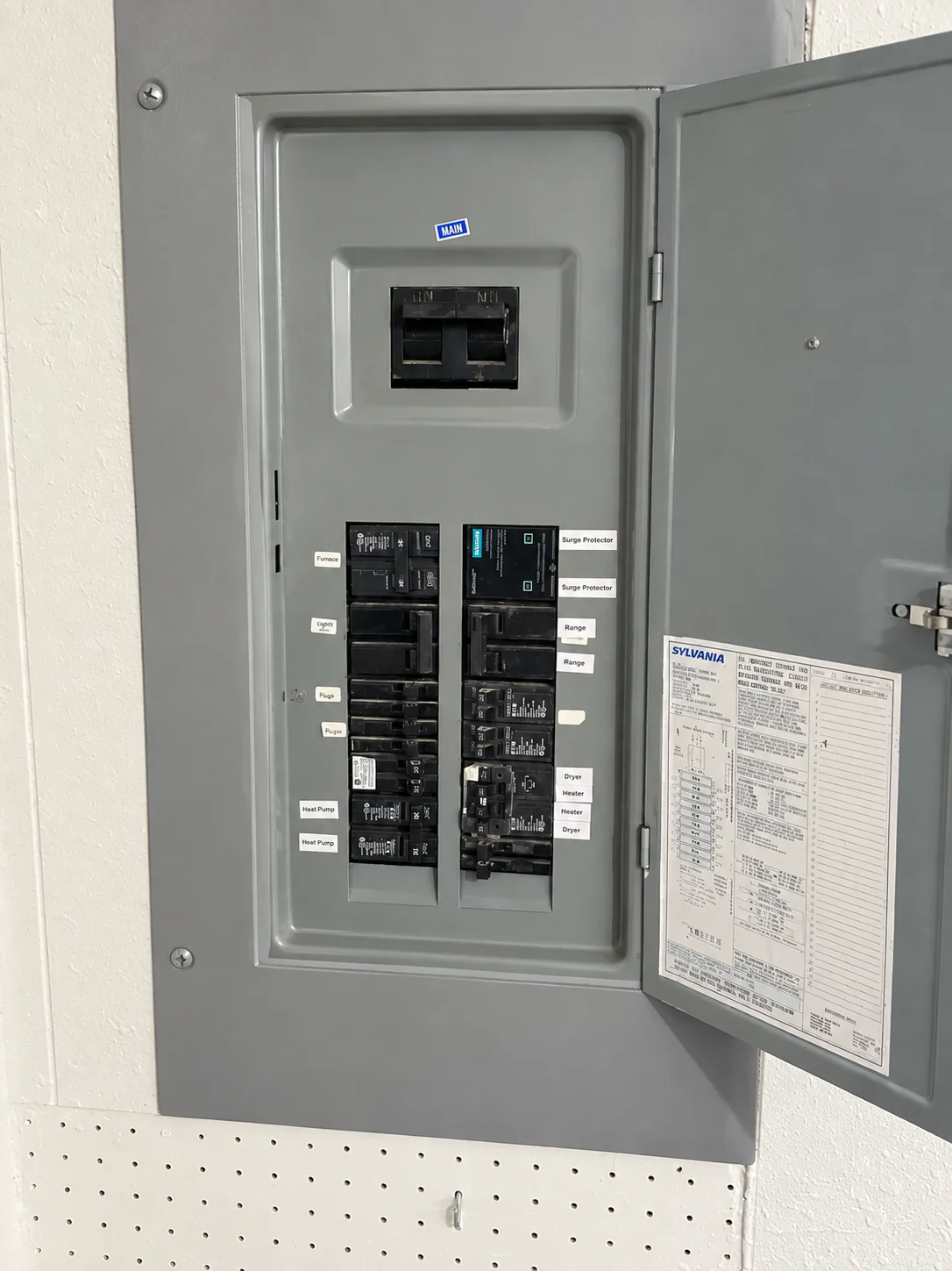 Open grey breaker box with labeled switches during an Electrical Panel Replacement Greater Puget Sound project.
