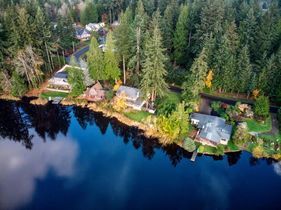 Waterfront homes among tall evergreens in Artondale, a community where Mayster offers HVAC services in Artondale WA to homeowners