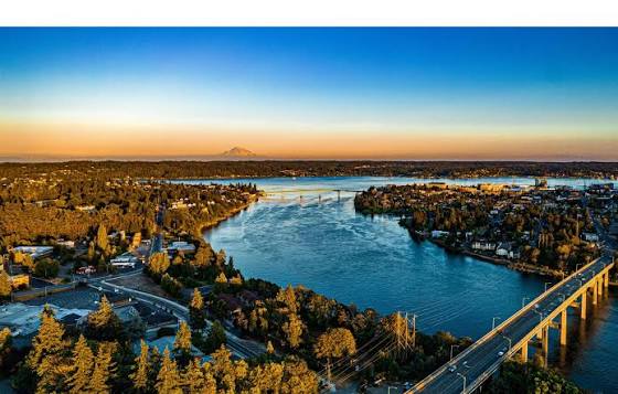 Sunset over Bremerton with a bridge spanning the water, a community where Mayster offers HVAC services in Bremerton WA to homeowners