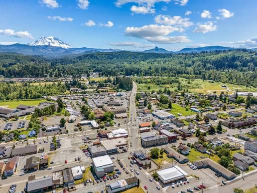 Aerial view of Eatonville streets and homes with Mount Rainier in the distance, where Mayster delivers HVAC services in Eatonville WA to nearby families