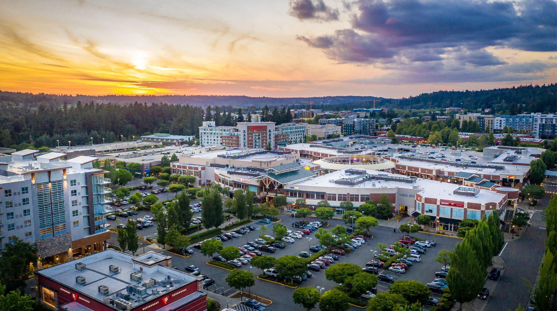 Aerial view of Redmond Town Center shops and parking at sunset, a busy area where Mayster provides HVAC services in Redmond WA for local homes