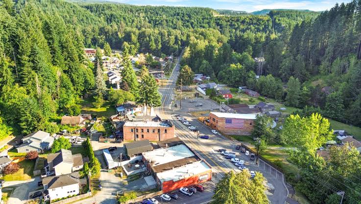 Aerial view of the small town of Wilkeson tucked into forested hills, where Mayster provides HVAC services in Wilkeson WA for local homes