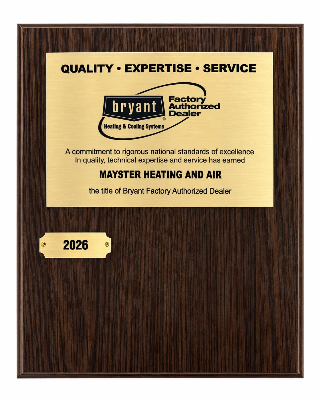 Wooden plaque with a brass plate honoring Mayster Heating and Air as a Bryant Factory Authorized Dealer in 2026.