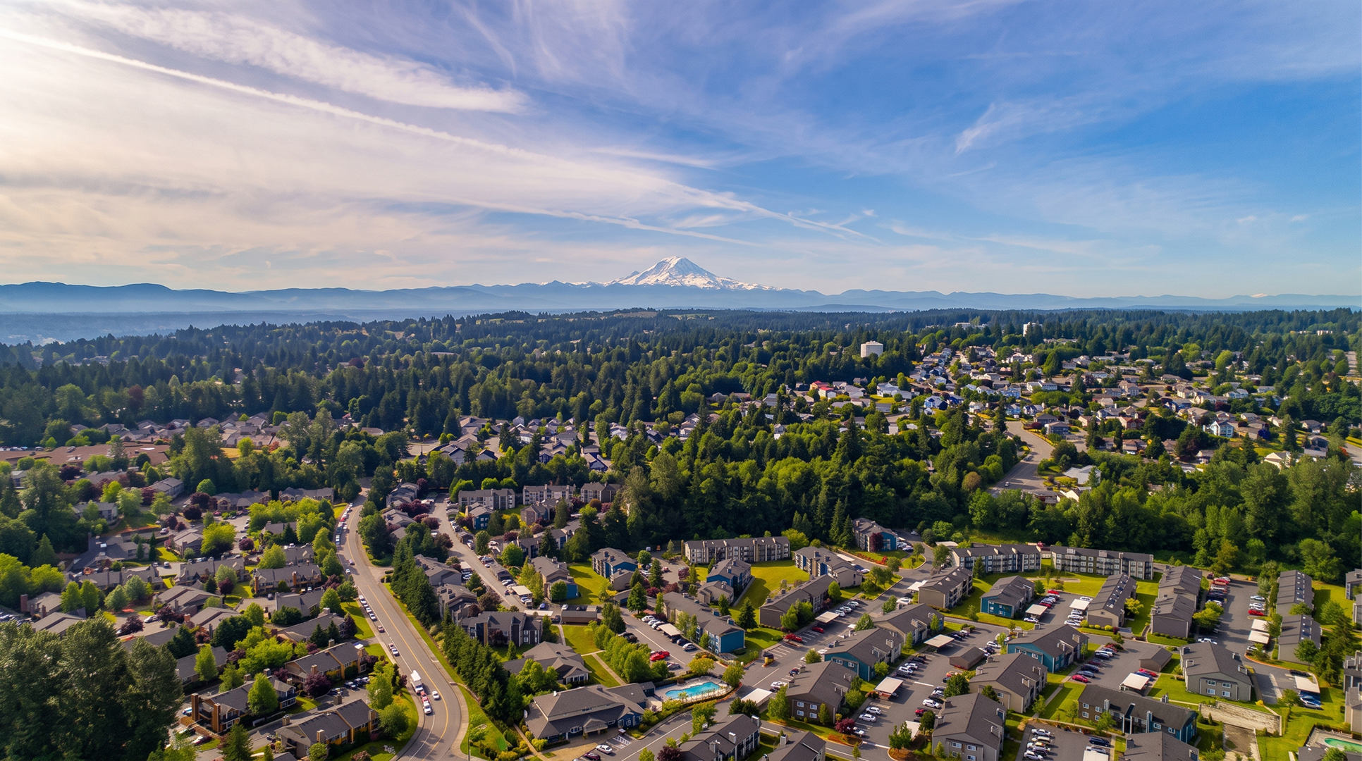 Aerial view of Kent residential neighborhoods stretching toward Mount Rainier, a community where Mayster offers HVAC services in Kent WA to local families