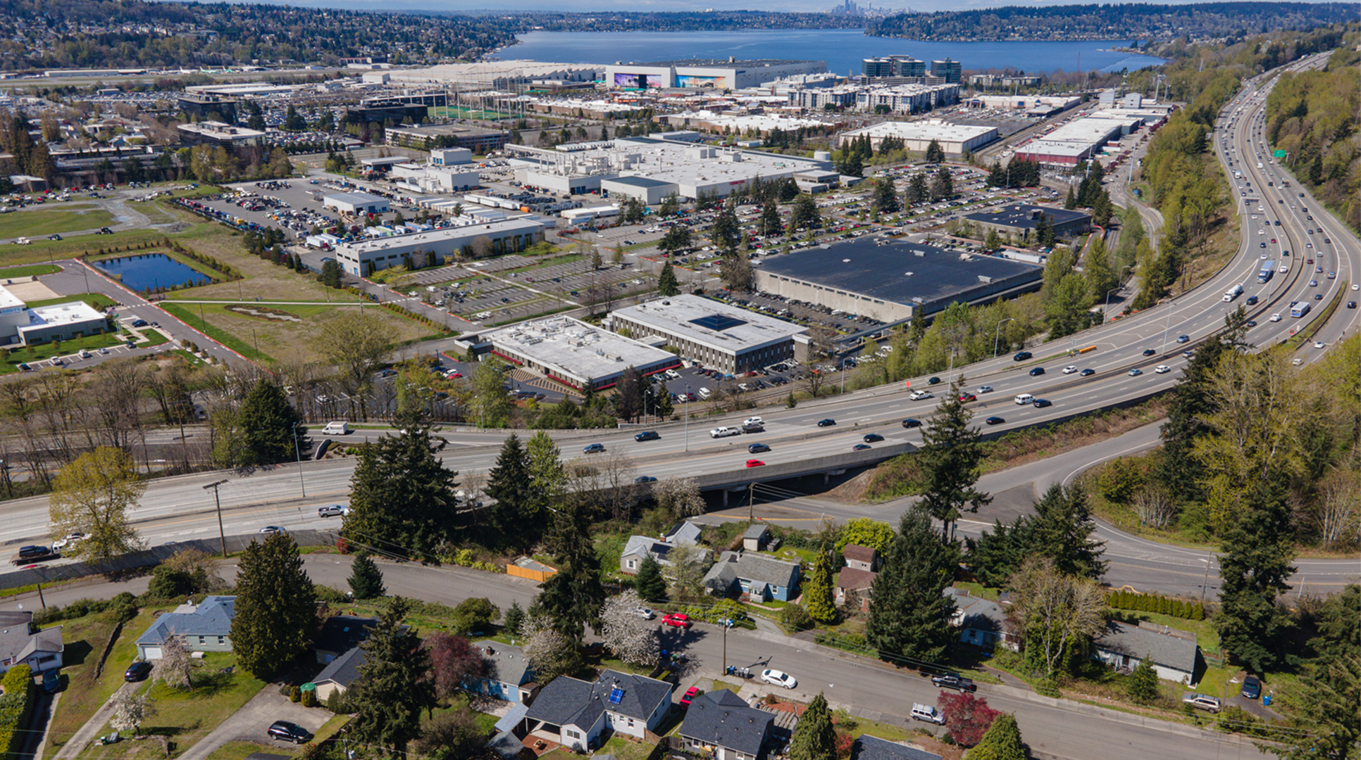 Aerial view of Renton with the freeway, business district, and Lake Washington in the distance, an area where Mayster provides HVAC services in Renton WA for homeowners