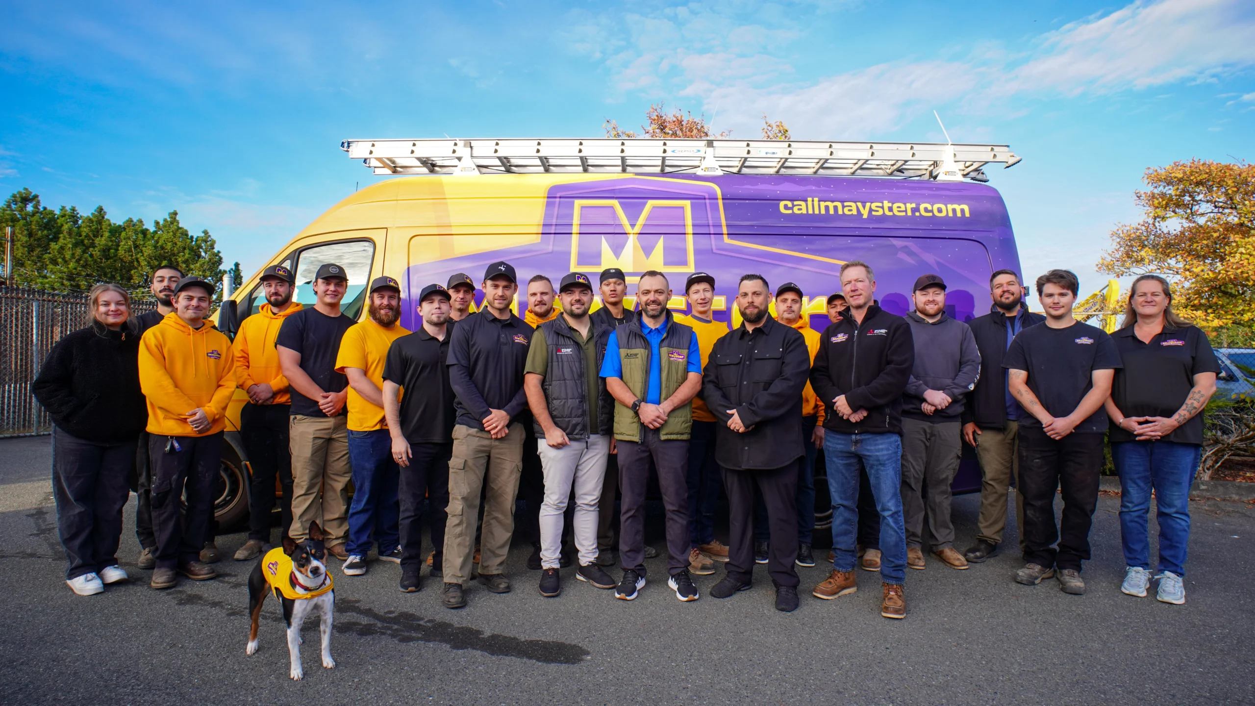 Mayster team stands in front of a purple and yellow van, highlighting their trusted HVAC financing Washington services.